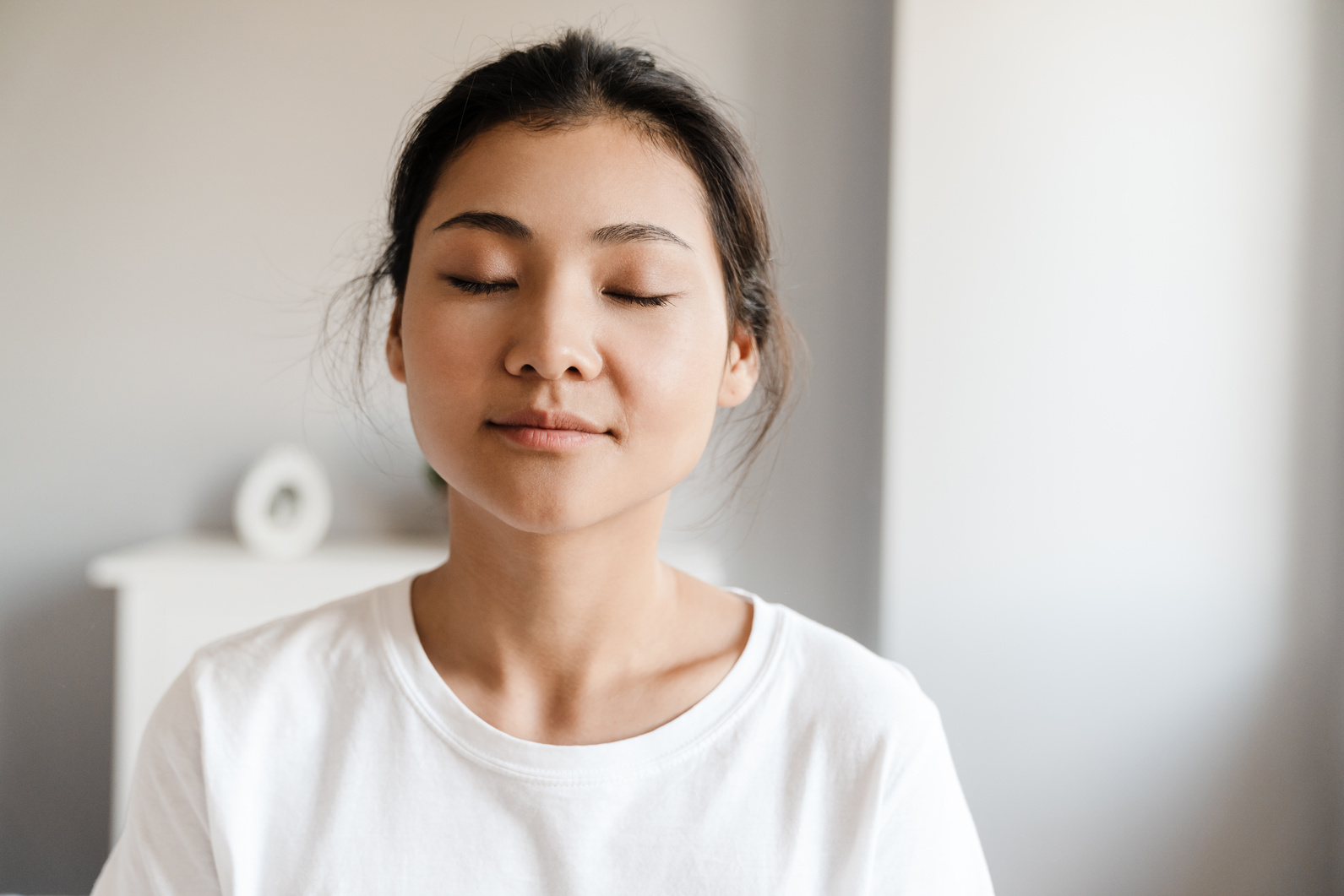 Close up of a Smiling Young Asian Woman Relaxing
